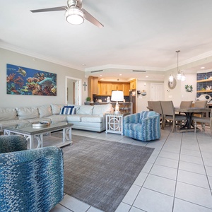 Relax on the cozy sofa with a queen sleeper in this inviting family room with beautiful balcony views