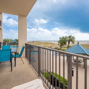 Enjoy meals or drinks at the outdoor dining set while taking in views of the beach and nearby pool area