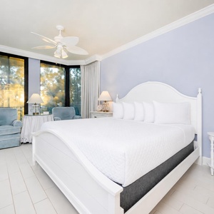 Retreat to the king master suite with cozy bedding and drift off to coastal sights and sounds of the bay