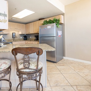 Gather around the stylish bar seating for casual meals while enjoying the inviting kitchen atmosphere