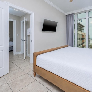 Relax on the cozy king bed in this guest suite and stream your favorite shows after a beach day
