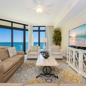 Relax in your inviting living area, where plush seating and expansive views create the perfect spot for family gatherings