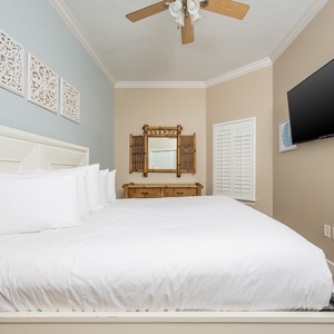 Relax on the cozy king bed in this guest suite and stream your favorite shows after a beach day