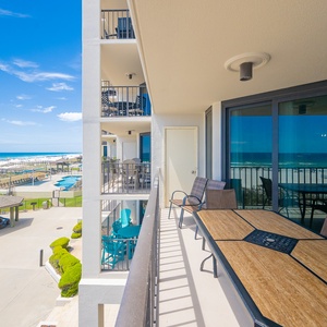 Savor the coastal breezes while watching children splash in the pool below