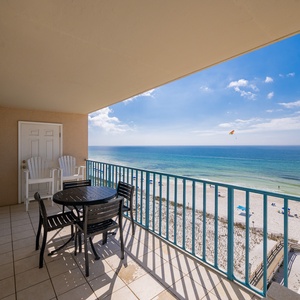 Gentle waves lap as you relax on your balcony watching colorful parasails drift through the bright sky