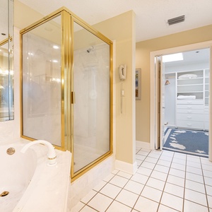 Indulge in relaxation with a soaking tub, a spacious walk-in shower, and a bright vanity area in the master bath