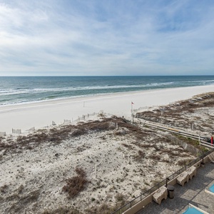 Enjoy the refreshing view of gentle waves and open shoreline from your balcony, perfect for relaxation and unwinding