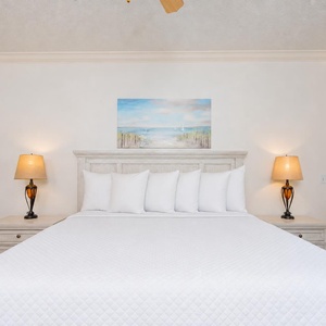 Sleep peacefully on a plush king bed, embracing comfort as you drift off to the sounds of the bay