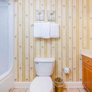 Enjoy a relaxing shower after a day of adventure in this guest bath with stylish accents and fluffy towels