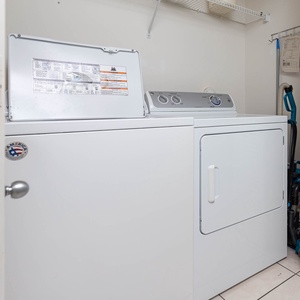 This laundry area features convenient appliances to keep your vacation clothes fresh and ready for beach adventures
