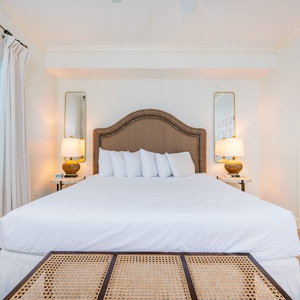 Sleep soundly in the soft, fluffy king bed while soft lighting fills the room, enhancing your restful escape