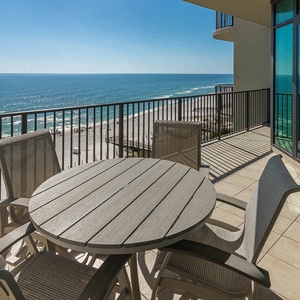 Unwind on your balcony, taking in stunning coastal views while sipping a refreshing drink