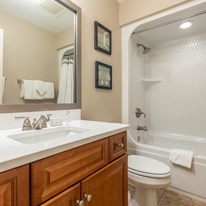 Refresh in this guest bathroom, where elegant decor enhances your cozy vibe after a day on the coast