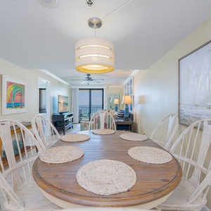 Gather around the charming dining table, sharing stories and laughter as you savor the beach vibe of your getaway