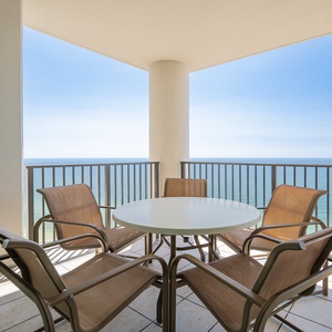 Enjoy breathtaking views from the balcony, featuring a round table and comfortable seating for relaxation