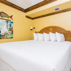 Unwind in this relaxing king guest suite with coastal accents and drift off into a peaceful slumber