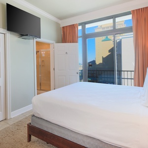 Relax on the cozy king bed in this guest suite and enjoy a movie or the stunning views from the balcony