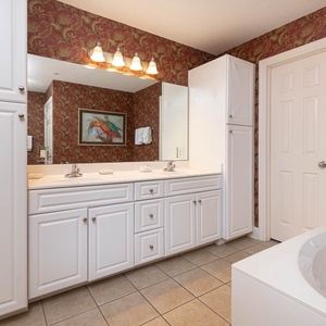 Indulge in relaxation in the master bath with a refreshing walk-in shower and soothing jetted tub