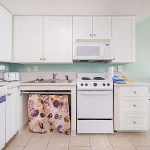 The kitchen and living space includes a bar area with lowered counters for ease of accessibility