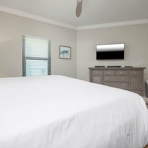 Relax on the cozy king bed in this guest suite and stream your favorite shows after a fun vacation day