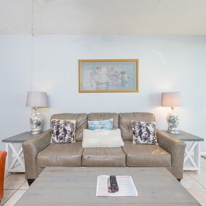 Sink into the plush couch, embrace the serene vibe, and enjoy your favorite show while the warmth of the sun spills in