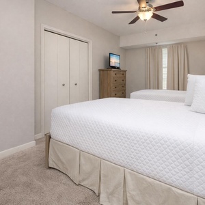 Unwind in this guest suite with two double beds and enjoy a good movie after a beach day