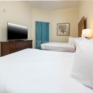 Rest on the soft double beds, ready to stream your favorite shows in this relaxing guest suite