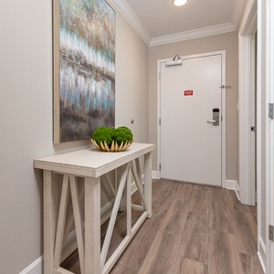 Step inside this welcoming entryway, where a stylish table and art invite you to unwind before your beach adventures