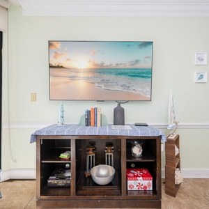 Enjoy the inviting decor with a large TV, games, and charming coastal accents that enhance your relaxation
