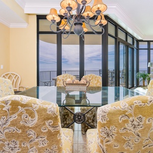 Gather around the elegant dining table, enjoying lively conversations while taking in coastal views through expansive windows