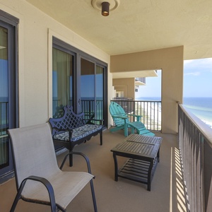 Enjoy the balcony with colorful seating and enjoy breathtaking views of the beach and sparkling waters