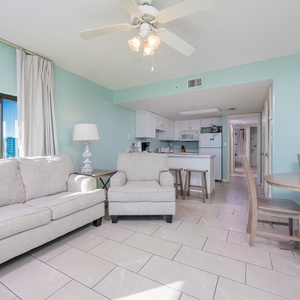 Relax in the airy living space with comfortable seating and panoramic views, perfect for enjoying time together