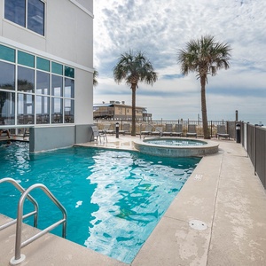 Take a dip in the outdoor pool or soak in the hot tub at Seawind in Gulf Shores or swin through to the indoor pool