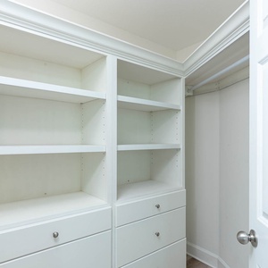 Store your belongings conveniently in the spacious closet with ample shelving and drawers for organization