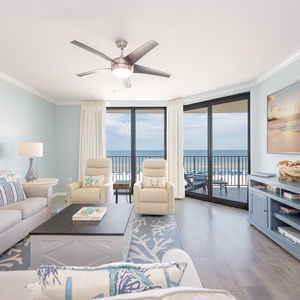 The living room invites you to unwind on the sofa queen while watching waves ripple beyond your balcony door