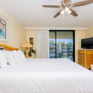 Retreat to the king master suite with cozy bedding and drift off to coastal sights and sounds of the bay