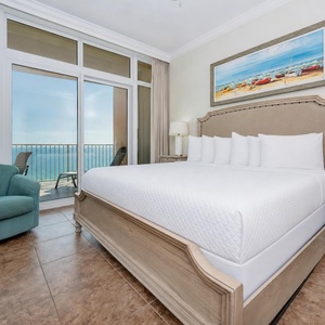 Experience restful nights in this inviting master bedroom, featuring a king bed and beachfront balcony access