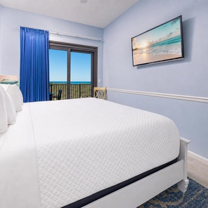 Enjoy restful evenings in the master suite with a king bed and coastal sights and sounds