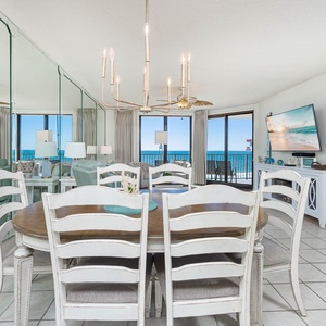 Dine at the charming table while enjoying views of the water and relaxing in the light-filled living area