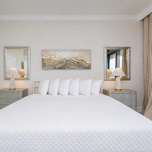 Experience restful nights on the king bed in the master, surrounded by elegant decor and beach views