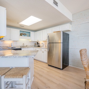 Granite counters gleam under soft lights as you prepare fresh meals in your kitchen with a coffee maker nearby