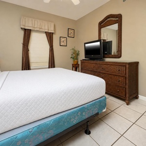 Unwind in this queen guest suite after a day at the beach and find a good movie