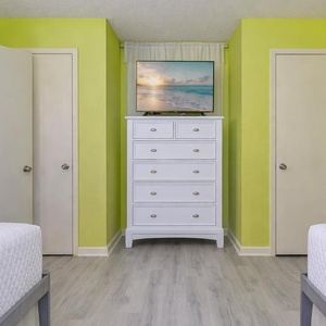 Cozy up in this cheerful bunk room, where laughter and fun await during family movie nights