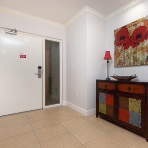 Step inside to a warm welcome, where vibrant art and cozy decor immediately invite you to unwind in style