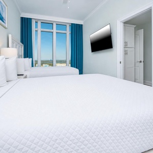 Wake up to coastal views in the queen guest suite and get ready for a day at the beach