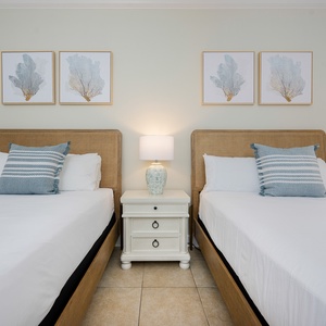 Relax on one of the cozy queen beds in this guest suite and enjoy a peaceful slumber