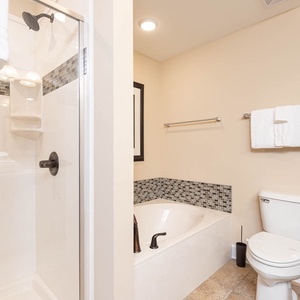 Relax in a luxurious soaking tub or enjoy an invigorating shower to refresh after a day at the beach in the master bath