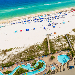 Sunshine glints off the lazy river where you lounge poolside watching kids splash and play nearby