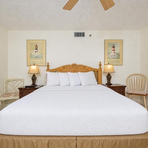 Unwind in this guest bedroom featuring a queen bed, soft linens, and coastal decor