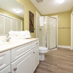Refresh in this additional guest bath with a walk-in shower and laundry area with a washer and dryer in your rental